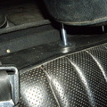 trim piece screwed to parcel shelf